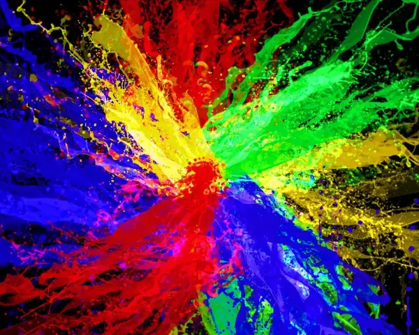 Eksplozja kolorów: czerwony, zielony i niebieski tworzą dynamiczną paletę kolorów RGB na czarnym tle.