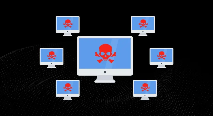 Komputery z czerwonymi czaszkami na ekranach, symbolizujące atak DDoS.